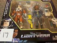 Front view of sealed Disney • Pixar Lightyear box showing both action figures and accessories