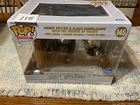 Front view of boxed Funko Pop Moment 145 set
