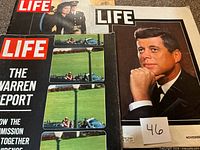 Stack showing three Life magazines including JFK portrait, Warren Report issue, and JFK with Jacqueline cover
