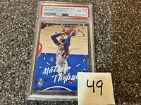 Front view of PSA-slabbed card showing full card design and grade label