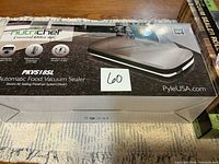 Front of boxed NutriChef PKVS18SL vacuum sealer showing model and branding