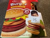 Front view of sealed Burger Stacking Game box showing product image and 21-piece count