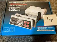 Front of retail box showing console and controller