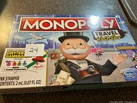 Front of sealed Monopoly Travel World Tour game box