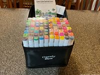 Full set of markers in black Ogeely 80pcs case with pad visible