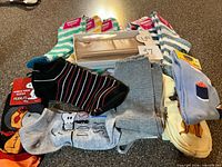 Group view of wallet and multiple pairs of new socks