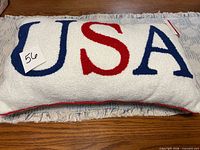 Full view of pillow front showing entire "USA" text and tag