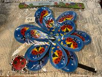 Full packaged wind spinner showing design and stake