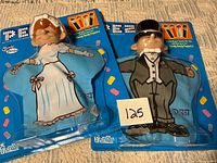 Front view of both sealed PEZ Bride and Groom puppets