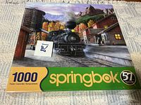 Front view of sealed Springbok 1000-piece puzzle box showing locomotive artwork