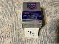 Front view of sealed Super Bowl XXV commemorative card set box with lot number card