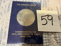 Front of sealed display card showing coin and inscriptions