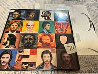 Front cover showing 16 painted portraits and lot tag