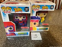 Front view of both boxed Funko Pop! figures