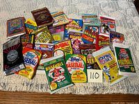 Group shot of all unopened sports card packs laid out on table