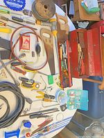 Tabletop overview showing toolbox and assorted tools
