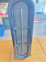 Front view showing perforated grill and tower form