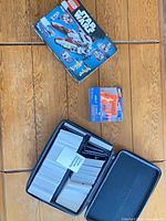 Overall lot showing LEGO box, NERF Jolt package, and carrying case with Cards Against Humanity cards