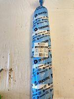 Full view of sealed Duchesne polyethylene sheeting roll in blue branded wrapping