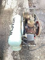 Overhead view showing full compressor, tank, motor, pump and belt drive