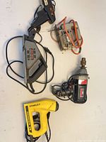 Group view of five corded power tools