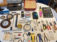 Overall view of all hand tools laid out with toolbox