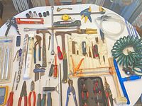 Overview of all hand tools spread on table