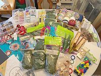 overview of entire mixed craft supply lot on table