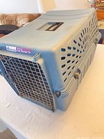 Front and top view showing metal door, handle, overall condition