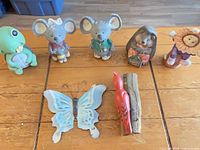All seven resin garden figurines displayed on table