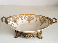 side view showing full bowl on gilt bronze base