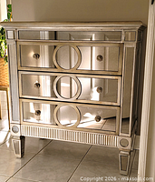 Front view of mirrored 3-drawer dresser