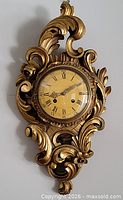 Front view of giltwood Westerstrand cartel wall clock