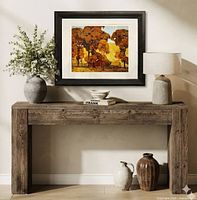 Context view of framed lithograph on console table