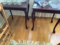 Both matching end tables showing tops and legs