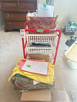 Full view of storage cart with fabric pieces in and around it