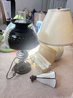 Overview showing black metal lamp, ceramic rabbit lamp shade, Onyx LED strip lights box and additional lamp parts