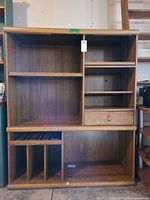 Front view showing entire cabinet layout with shelves, drawer, and dividers