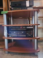 Front view showing four wood shelves and aluminum supports