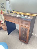 Front and side view of wood sewing desk with measuring tools on top