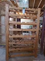 Front view of full wine rack showing eight tiers and overall design