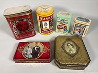 Group shot of all six tins showing fronts and general wear