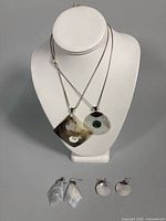full set showing two necklaces and two earring pairs