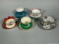 All five teacup and saucer sets group view