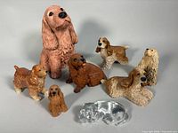 Group shot of all eight Cocker Spaniel figurines