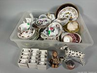 overview of bin with china, napkin rings boxes, figurines, glass birds