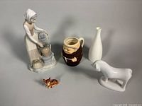 Group shot of all five ceramic and porcelain items in the lot