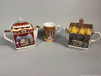 Group shot showing both teapots and mug front view