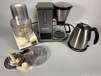 All three Cuisinart appliances and processor accessories