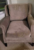 Front view of Craftmaster wingback armchair showing upholstery, cushions, nailhead trim and legs